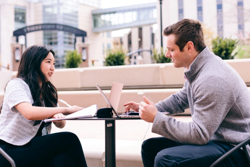 Two graduate students working together