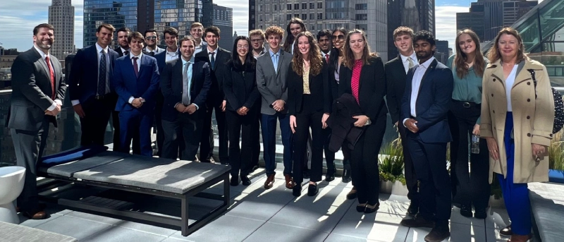 Group of students and faculty pose together