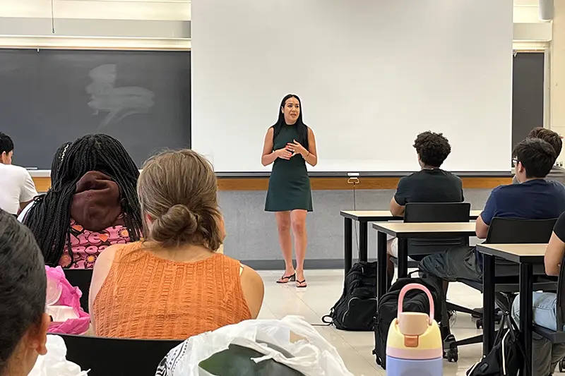 speaker discussing work with class