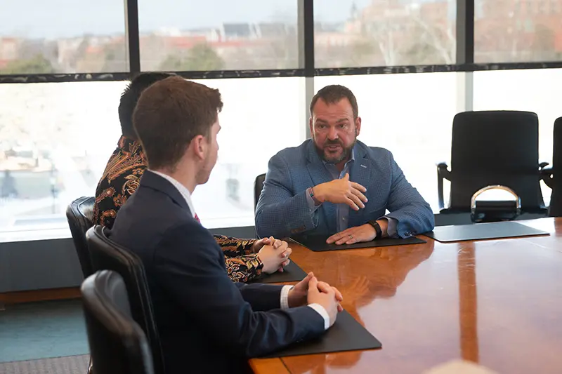 Executive Forum Speaker Brent Yeagy with students
