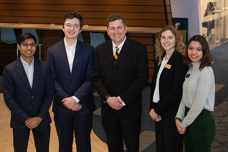 Executive Forum Speaker Josh Zuerner with students