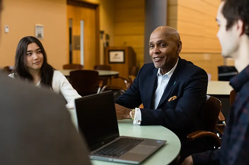 Executive Forum Speaker Roland Parrish meeting with students