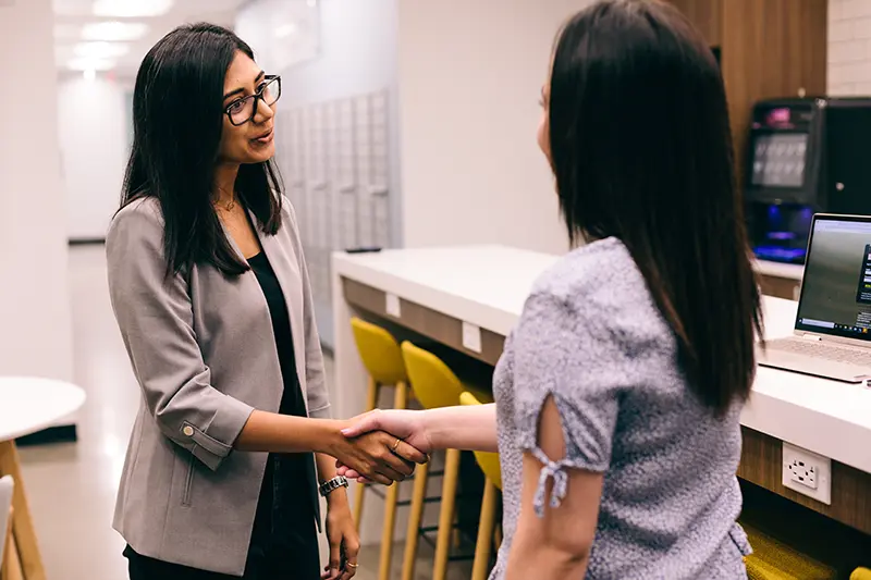 Two individuals meeting