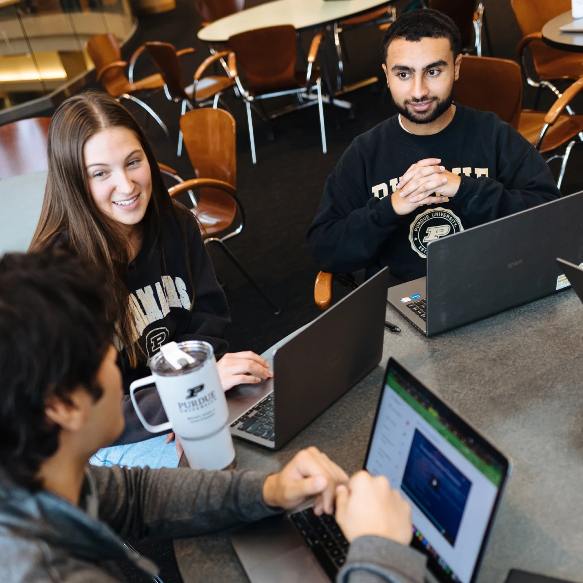 group of students collaborating at table