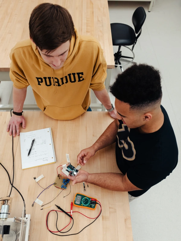 Two students working on engineering project